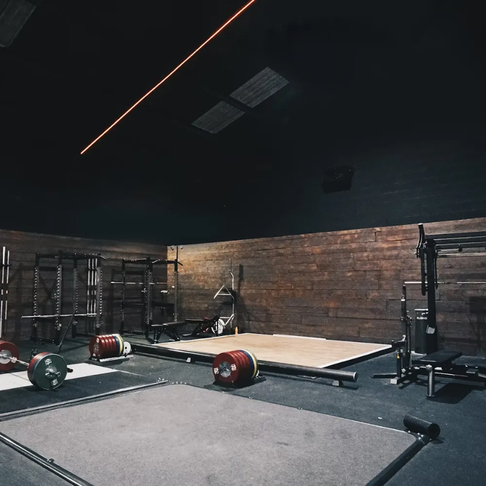 Strength training area with dumbbells and benches